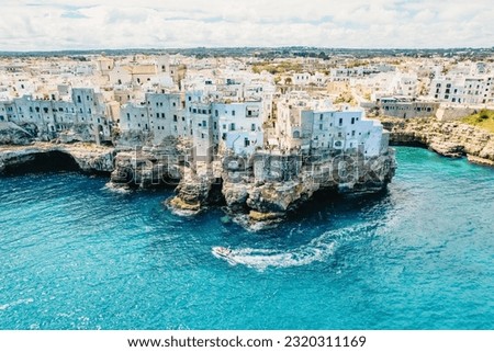 Spectacular spring cityscape of Polignano a Mare town, Puglia region, Italy, Europe. Colorful evening seascape of Adriatic sea Royalty-Free Stock Photo #2320311169