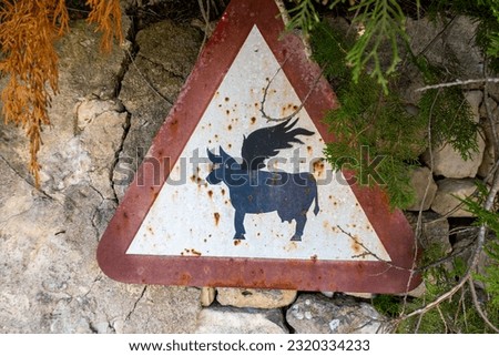 Funny livestock traffic sign. Cow with wings.