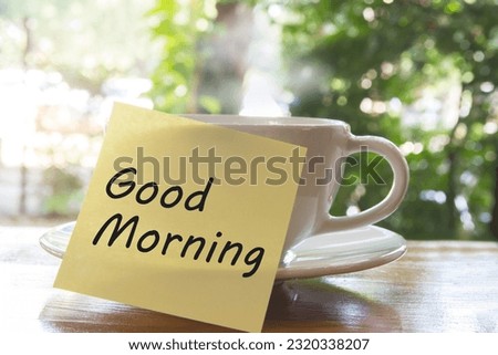 Paper note word Good morning the hot coffee cup.