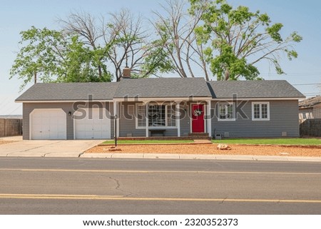 Ranch style home in a residential area in Page Arizona. Royalty-Free Stock Photo #2320352373