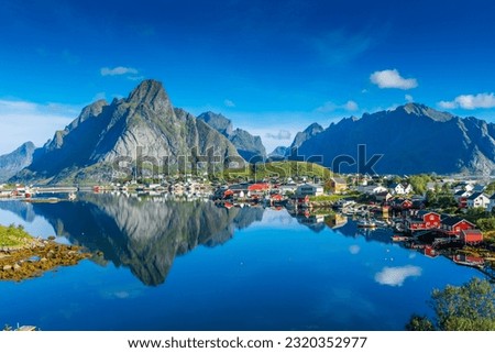 Perfect reflection of the Reine village on the water of the fjord in the Lofoten Islands, Norway Royalty-Free Stock Photo #2320352977