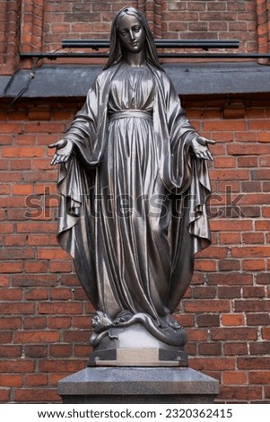 Bronze statue of Virgin Mary Immaculate outside of the Cathedral Basilica of apostles St. Peter and St. Paul of Kaunas, Lithuania Royalty-Free Stock Photo #2320362415