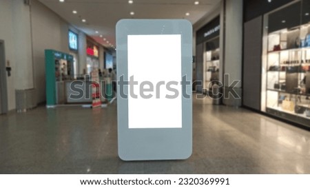 Blank advertising banner mockup in modern airport retail environment; large digital display screen. Billboard, poster.