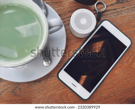 Green tae milk and bluetooth speaker and smart phone