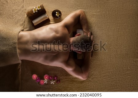 Men is ready for massage. Spa treatments Royalty-Free Stock Photo #232040095