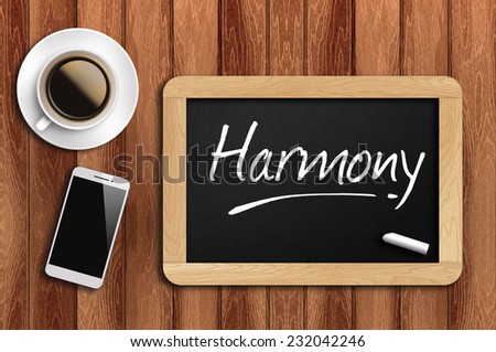 Phone, Coffee And A Chalkboard On The Wooden Table Written Harmony.