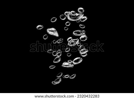 Oxygen bubbles in clear liquid underwater with air bubbles rise to the surface. isolated on black background Royalty-Free Stock Photo #2320432283