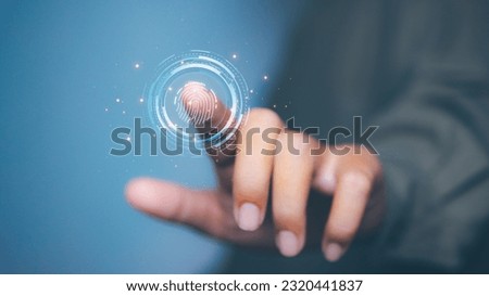 Businessman access scan fingerprint biometric identity and approval. Secure access granted by valid fingerprint scan, cyber security on internet. cybernetic business concept. Royalty-Free Stock Photo #2320441837