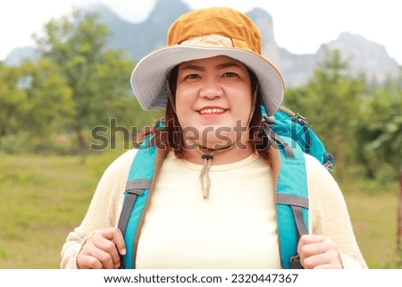 Portrait of a smiling asian fat woman happy travel nature on vacation. Asian tourists. hiking