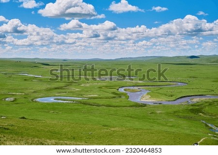 The river and hills in the summer grassland of Hulunbuir Royalty-Free Stock Photo #2320464853