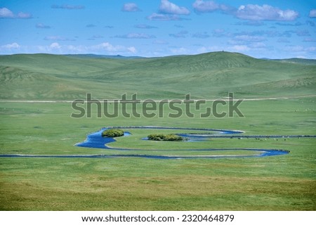 The river and hills in the summer grassland of Hulunbuir,Trees in the river Royalty-Free Stock Photo #2320464879