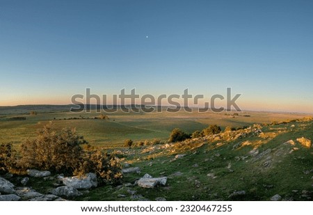 Sunset on sunny day in the countryside of Uruguay. Royalty-Free Stock Photo #2320467255