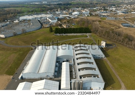 Aerial view of modern factory structure for production and distribution of industrial equipment. Concept of global industry