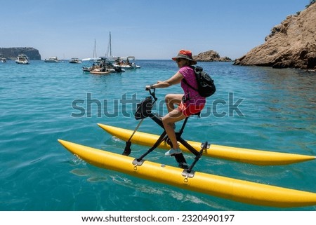Tourist on water bike in the turquoise sea.