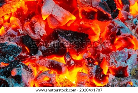 Fire in the fireplace. Aged wood smells wonderful, so if you're going to burn it, choose logs for the smoky, musky smell. Use kiln-dried logs to show your love for the environment. Royalty-Free Stock Photo #2320491787