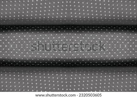 seamless. Fabric with a metallic sheen in small polka dots. black. Be the center of attention at your next event with a bold metallic polyester fabric design that delivers an incredibly fluid design