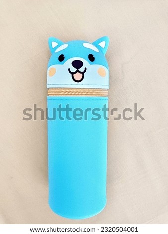 A cute blue dog-shaped pencil case.