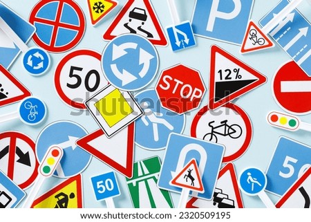Pattern of different road signs on the table. Flat lay, top view.