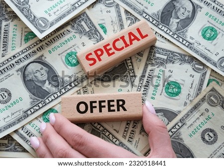 Special offer symbol. Concept word Special offer on wooden blocks. Beautiful dollar background. Businessman hand. Business and Special offer concept. Copy space