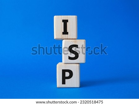 ISP - Internet Service Provider symbol. Concept word ISP on wooden cubes. Beautiful blue background. Business and ISP concept. Copy space.