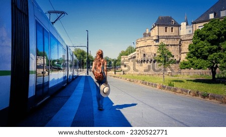 city life in Nantes, tramway and castle Duck of Brittany- France Royalty-Free Stock Photo #2320522771