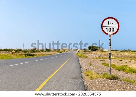 Highway road with speed limit sign - speed limit 100 kilometers per hour with arabic numerals and hindu-arabic