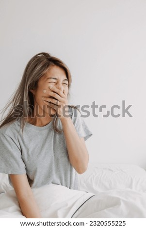 Funny face sleepy head asian woman just wake up in the morning dizzy and lazy. Royalty-Free Stock Photo #2320555225