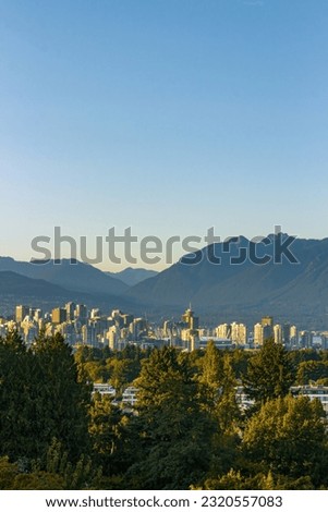 Skyline of Vancouver city with parks and mountains