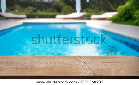 Table Top And Blur Swimming pool of the Background Royalty-Free Stock Photo #2320568203