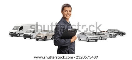 Car mechanic holding a clipboard and in front of parked vehicles isolated on white background

