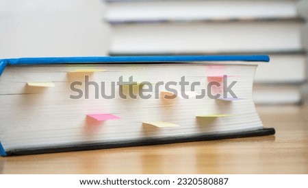Book instruction manual refrence sticky paper note blur background.