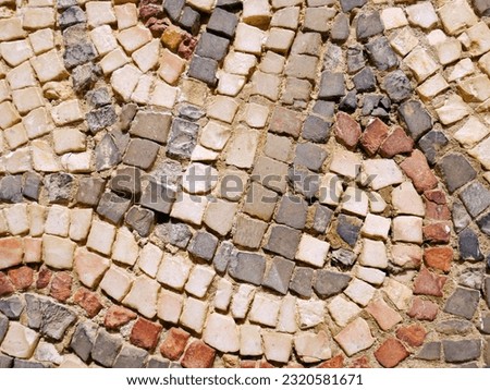 Historical wall or roof mosaic texture. Ancient archeological town with mosaics.