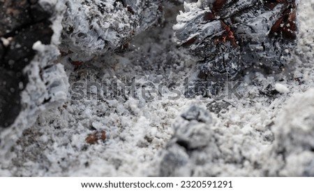 charred charcoal in grill, ash