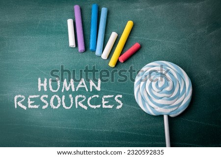 Human Resources. Employment Issues Concept. Text on a green chalkboard background. Royalty-Free Stock Photo #2320592835