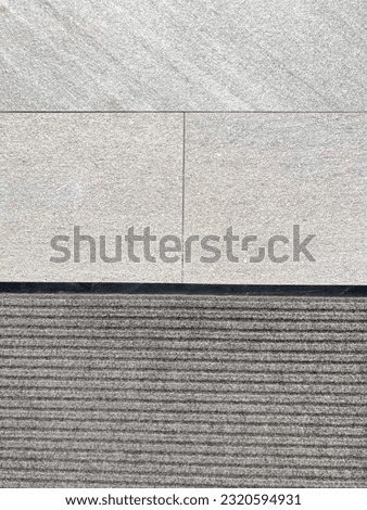 Gray floor tiles by swimming pool