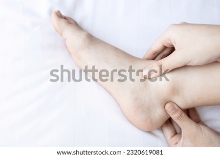 Young woman with Flat Feet,painful in heel,hurt the ankle,foot has an arch that is lower than usual,chronic pain,numbness in sole and toe,problem of physical injury from flat foot,health care concept