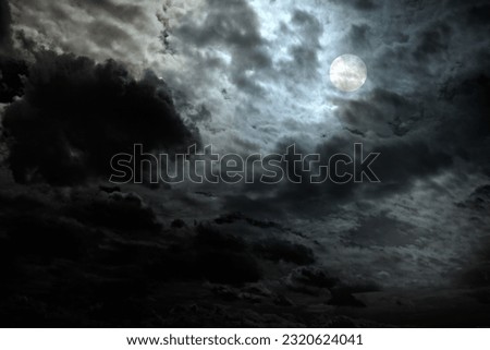 Cloudy full moon night with interesting light