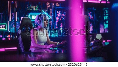 Digital Future with Stunning Young Woman Using a Computer in a Technologically Advanced Room with Futuristic Background. Perfect for Sci-Fi, Cyber Technology and Gaming Enthusiasts
