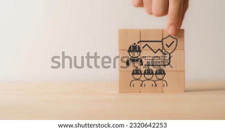 Zero accident and work safety concept. Placing wooden cube with icon of zero accident communication, training, performance. Hazards, protections, regulations and compliance. Working standard process. Royalty-Free Stock Photo #2320642253