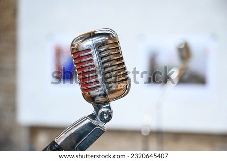Vintage microphone in concert hall. Old microphone. Classic retro vocal mic.