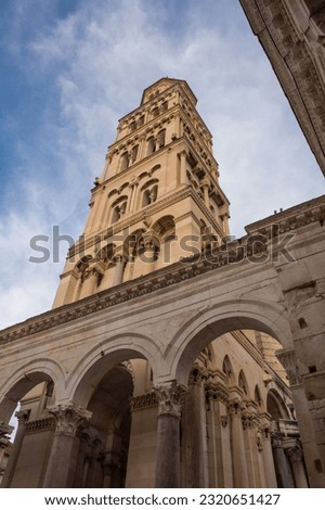 The Romanesque bell tower of the Cathedral of Saint Domnius - Katedrala Svetog Duje - in Split, Croatia. Located within the Diocletian Palace. Seen from Peristil  Royalty-Free Stock Photo #2320651427