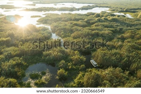 Visit Danube Delta by boat. Beautiful aerial landscape photo of this nature landmark in Romania.