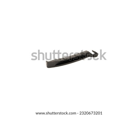 Plastic bike tire lever with comfortable grip to help quickly removal of bicycle tires isolated on white background. Bicycle repair gear cycling maintenance accessories with clipping path copy space