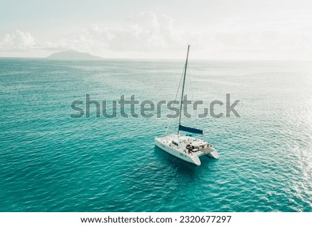 Yacht Catamaran Sailing in the Indian Ocean at Sunset. 