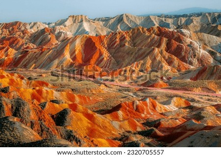 The Zhangye Danxia National Park located in the Gansu province in China s northwest is UNESCO World Heritage Site. Rainbow mountains have unusual colours of the rocks. Sunset picture
