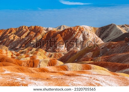 Amazing scenery of Rainbow mountain and blue sky background in sunset. Zhangye Danxia National Geopark, Gansu, China. Copy space for text Royalty-Free Stock Photo #2320705565