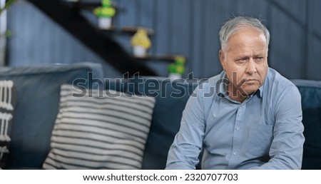 Worried retired senior man sitting alone on sofa feel sorrow abandoned anxiety at home. Unhappy Indian middle aged male grieving think lonely depressed pensive suffering health problems  Royalty-Free Stock Photo #2320707703