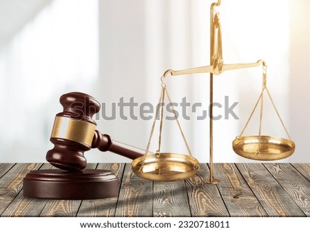 Lawyer wooden hammer on table in office