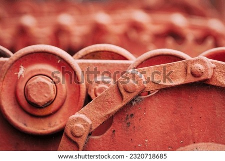 Macro image of painted gears and chains in Ketchican, Alaska Royalty-Free Stock Photo #2320718685