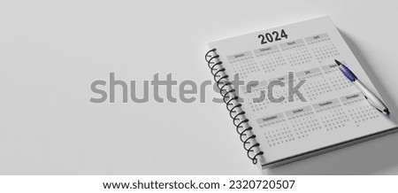 2024 white desk calendar on white background. Close Up Pencil On Calendar 2024. Pencil on calendar on white using as writing agenda or important memo and appointment and planning on calendar Royalty-Free Stock Photo #2320720507